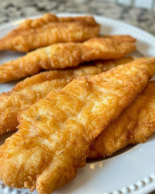 Przepis na idealną smażoną rybę, która rozpływa się w ustach.